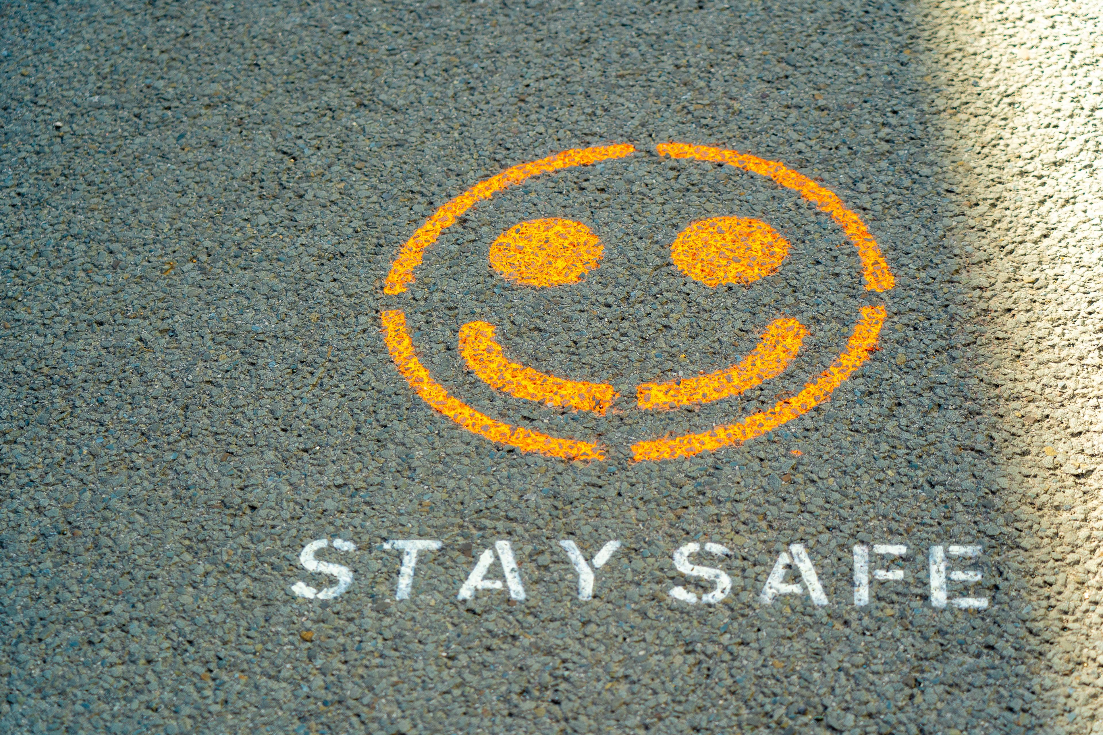 A smiley face drawn on tarmac.