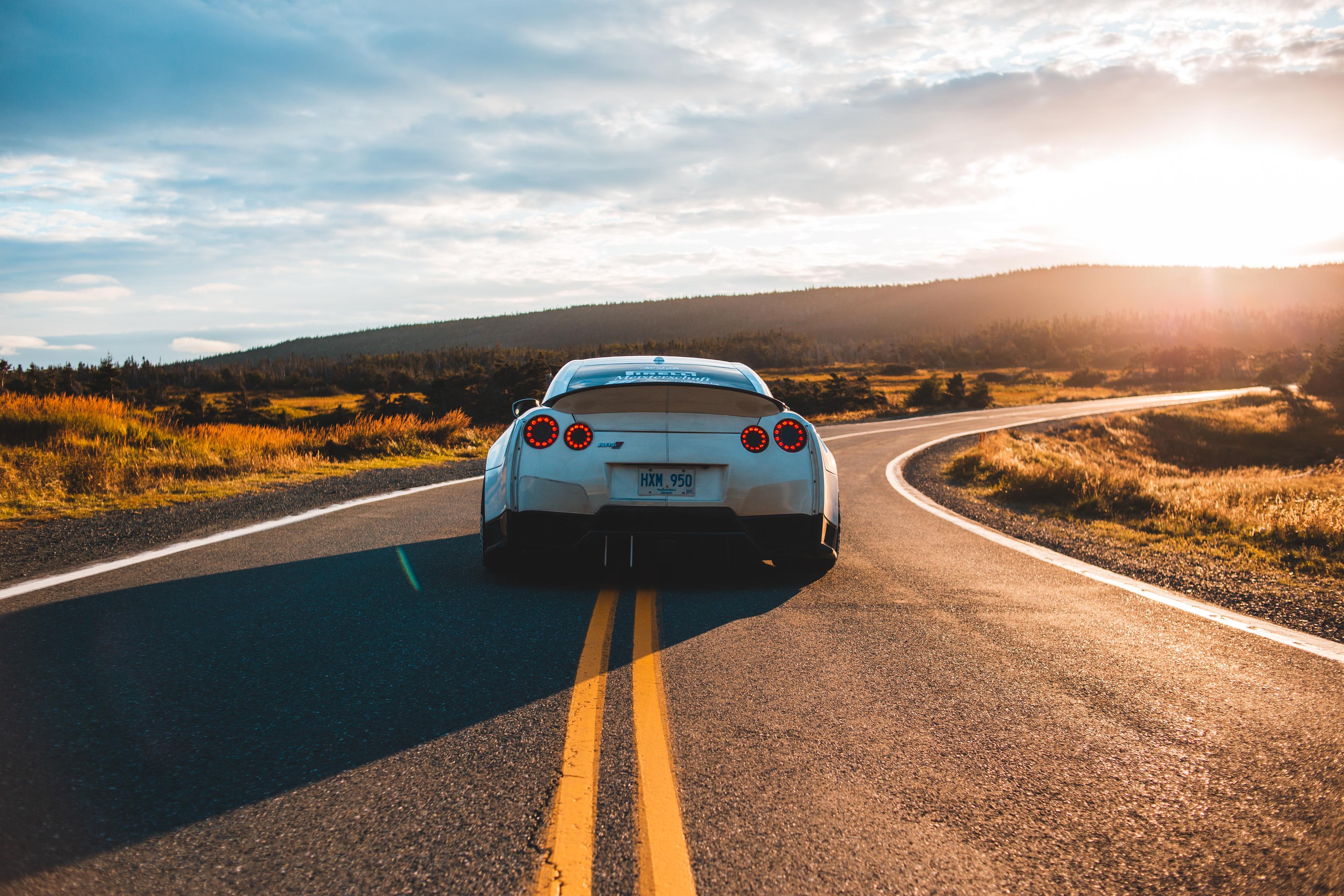 A car in the middle of the road.