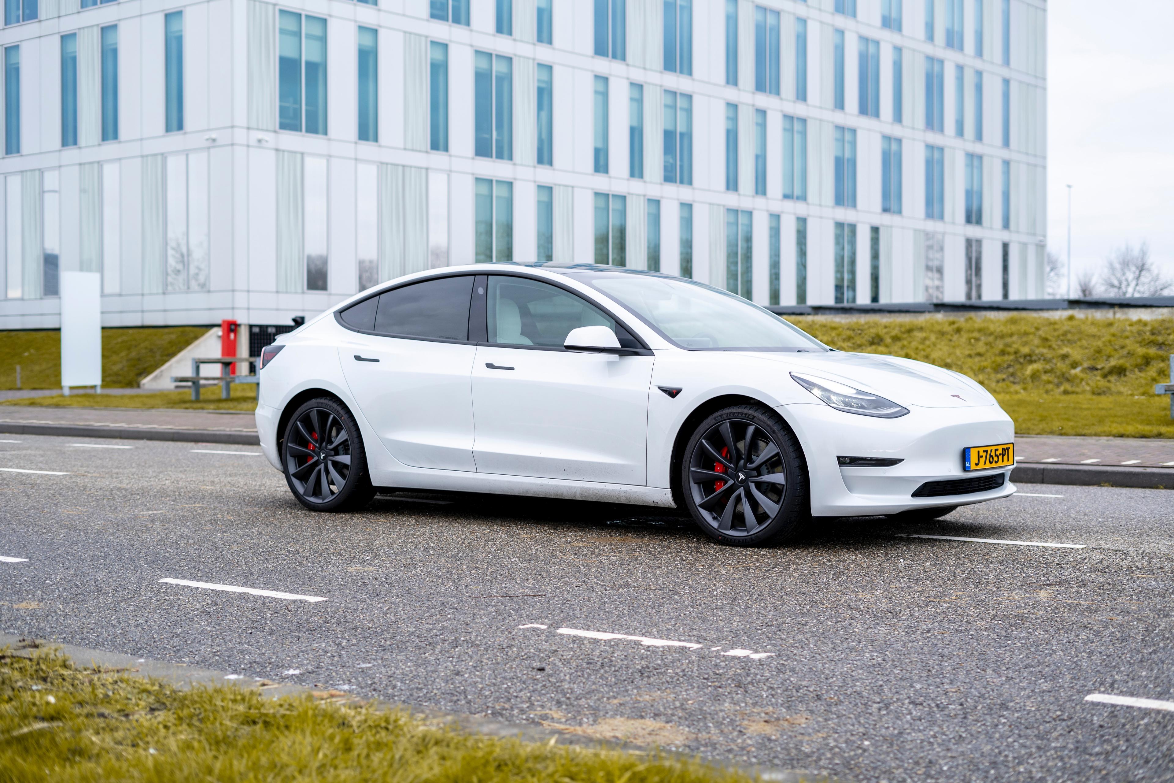 A white Tesla Model 3.