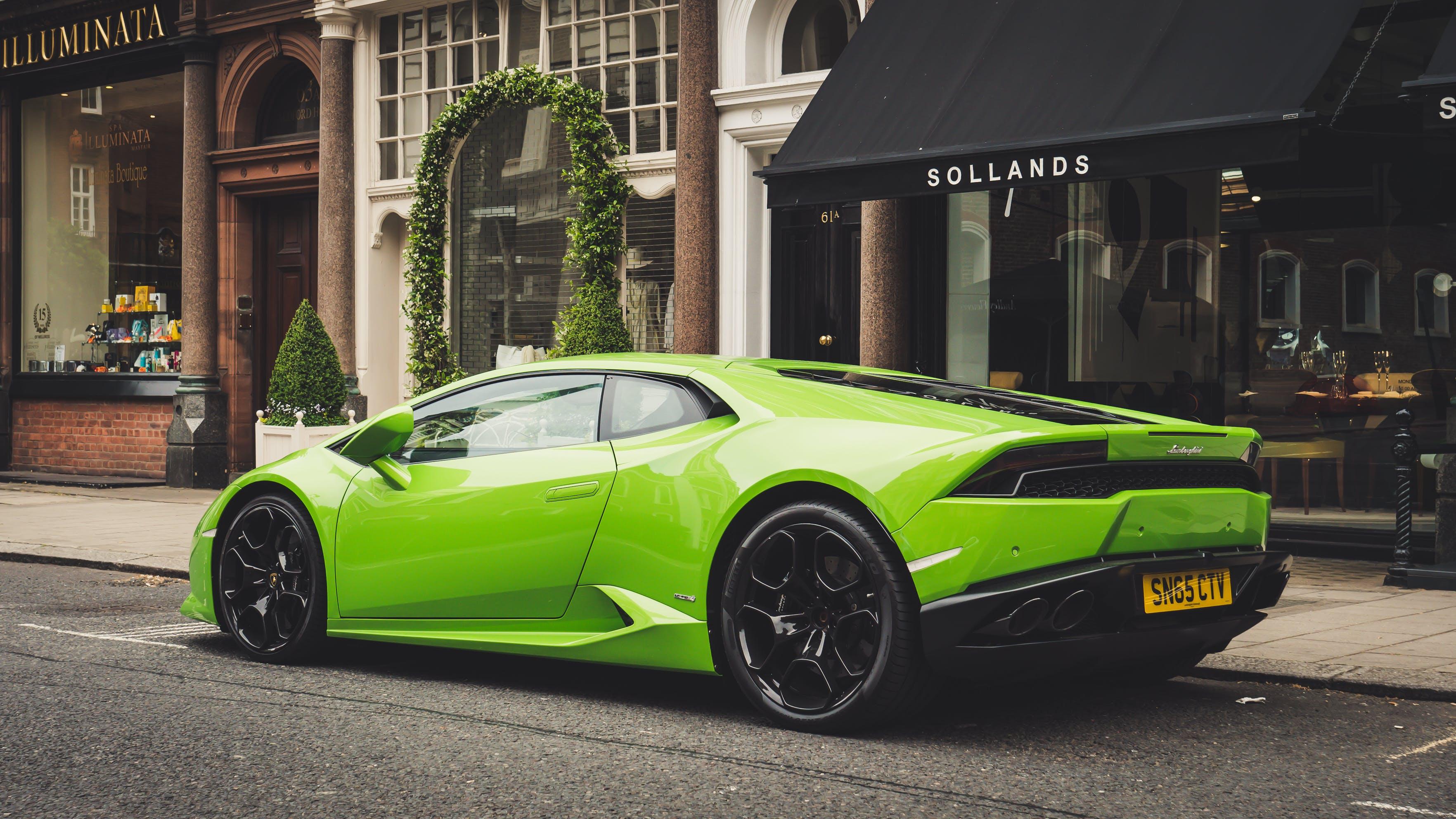 a green Lamborghini on a city street